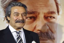 Türk sinemasının efsane ismi Kadir İnanır'ın takım elbiseli saygın bir duruşunu gösteren arşiv fotoğrafı.